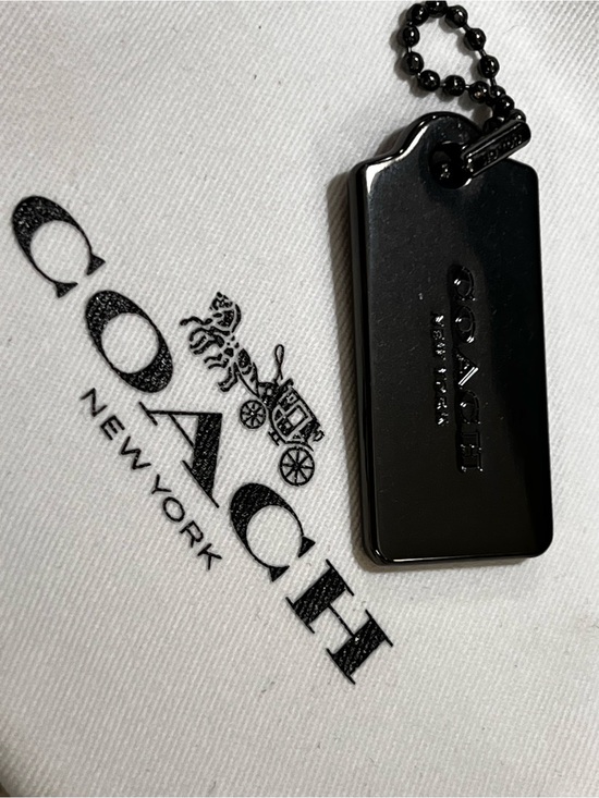 Coach Accessories - Coach black metallic  Black Logo Tag Pendant